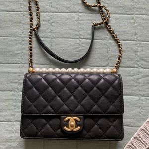 Black Chanel bag with pearls